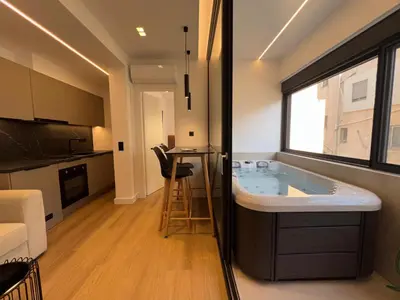 a bathroom with a tub in the middle of a room at BlueMotion - CruiseNest Complex in Piraeus