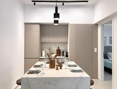 a kitchen with a table with plates and wine glasses at Secret Central Gem Near Kolonaki in Athens
