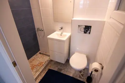 a small bathroom with a toilet and a sink at Nice Apartment in Athens center in Athens