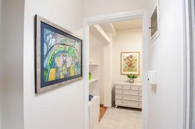 a hallway with a painting hanging on a wall at Work of Art Athens in Athens