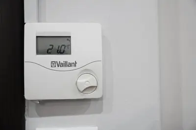 a clock on the side of a white machine at Athenian Petralona Suite near Athens City centre in Athens