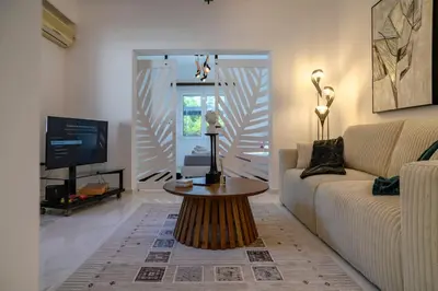 a living room with a couch and a coffee table at Seclusion, Privacy and 2 bedroom Luxury in Glyfada in Athens