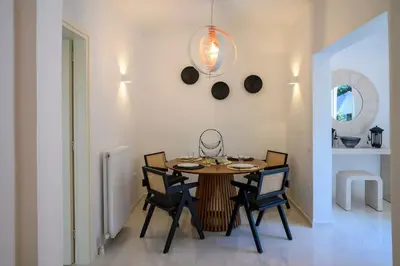 a dining room with a table and chairs at Seclusion, Privacy and 2 bedroom Luxury in Glyfada in Athens