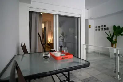 a glass table with a blender on it in a room at Premium Athenian District Urban Studio in Athens