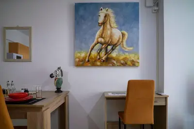 a painting of a horse on a wall at Premium Athenian District Urban 1 bedroom flat A in Athens