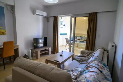 a living room with a couch and a table at Premium Athenian District Urban 1 bedroom flat A in Athens