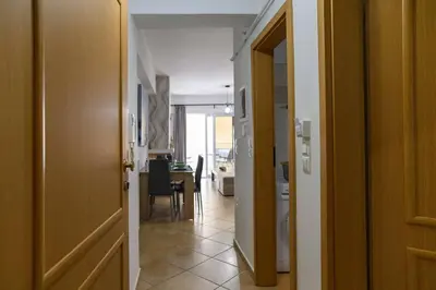 an open door to a hallway with a dining room at Premium Athenian District Urban 1 bedroom flat B in Athens
