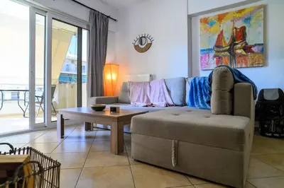 a living room with a couch and a table at Premium Athenian District Urban 1 bedroom flat B in Athens