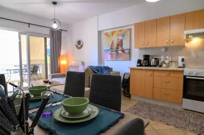 a kitchen and living room with a table and chairs at Premium Athenian District Urban 1 bedroom flat B in Athens