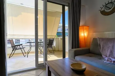a living room with a couch and a table at Premium Athenian District Urban 1 bedroom flat B in Athens