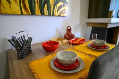 a table with two bowls and plates on a table at Premium Athenian District Urban 1 bedroom flat C in Athens