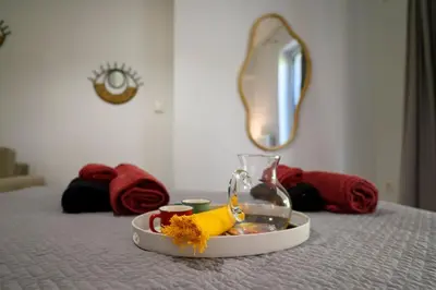 a tray of food on top of a bed at Premium Athenian District Urban 1 bedroom flat C in Athens