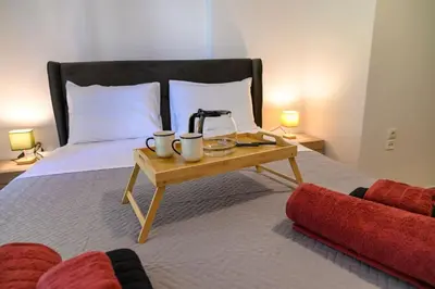 a bed with a table with a coffee maker on it at Premium Athenian District Urban 1 bedroom Flat D in Athens