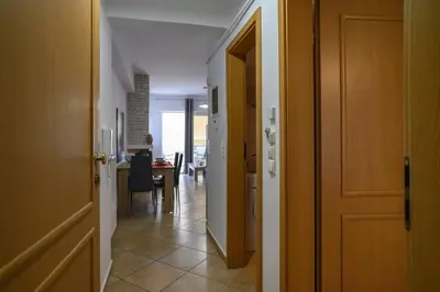 a hallway with a room with a table and a door at Premium Athenian District Urban 1 bedroom Flat D in Athens