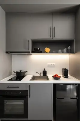 a kitchen with a sink and a stove at Fits Living in Athens
