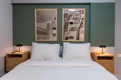 a bedroom with a large bed with two night stands at Zen Athens City Center in Athens