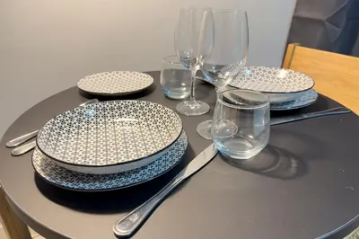 a table with plates and glasses on a table at Zen Athens City Center in Athens