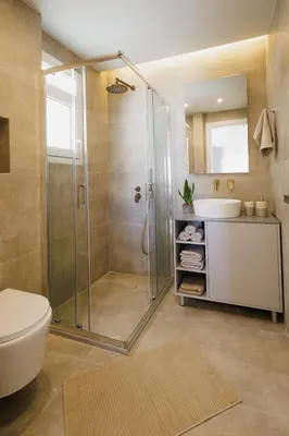 a bathroom with a shower and a toilet and a sink at Penthouse Nest for 3 persons in Athens