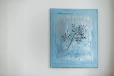 a painting of a tree on a white wall at Peaceful and comfy 2BA in Athens heart in Athens