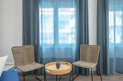 two chairs and a table in front of a window at Peaceful and comfy 2BA in Athens heart in Athens