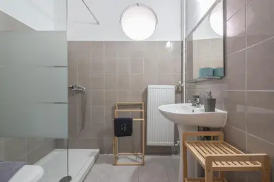 a bathroom with a sink and a toilet and a tub at Peaceful and comfy 2BA in Athens heart in Athens