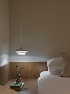 a bedroom with a white bed and a lamp at Presidential Suites, by Athens Stay in Athens