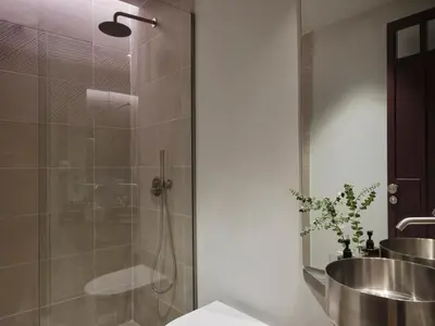 a bathroom with a shower and a sink at Presidential Suites, by Athens Stay in Athens