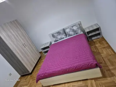 a bedroom with a bed with a purple blanket at Athens view in Athens