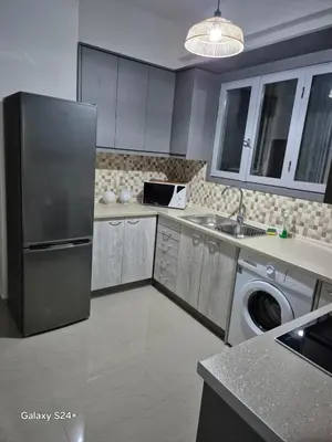 a kitchen with a stainless steel refrigerator and a dishwasher at Athens view in Athens