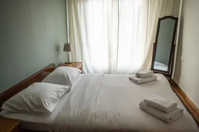 a bedroom with a bed with two towels on it at Casa al Museo in Athens