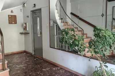 an empty hallway with stairs and a window at Casa al Museo in Athens