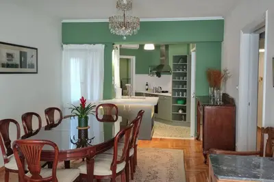 a kitchen and dining room with a table and chairs at Casa al Museo in Athens