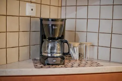 a blender sitting on a counter in a kitchen at Pinelopi Spotless 2 BR Renovated Apt Athens Center in Athens