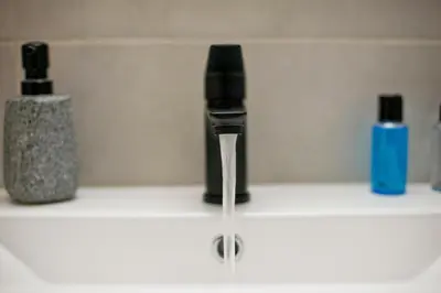 a faucet with water coming out of it on a sink at Pinelopi Spotless 2 BR Renovated Apt Athens Center in Athens