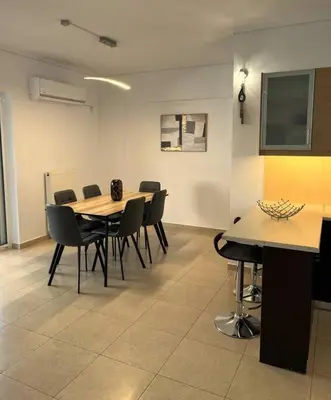 a conference room with tables and chairs and a flat screen tv at Enjoy The Athens Riviera! in Athens