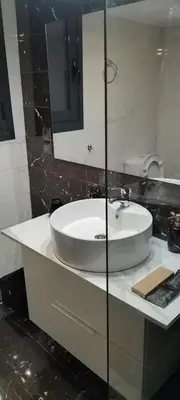 a bathroom with a white sink and a mirror at Luxury Semi-Basement Suite Athens in Athens