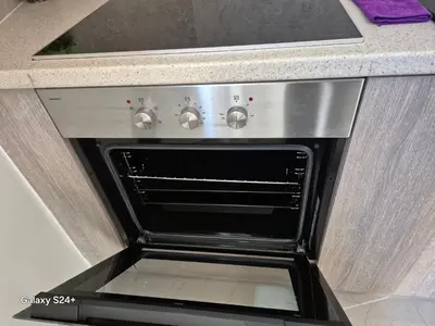 an oven with its door open in a kitchen at Lavender-Dalia cosy apartment center of Athens in Athens
