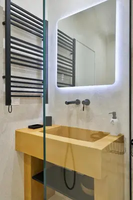 a bathroom with a wooden sink and a mirror at 2 BD Lycabettus Stylish Apartment by Live&Travel in Athens