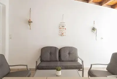 a living room with a couch and two chairs at Debbie's cozy 2bdr - 2bth apt near Acropolis in Athens