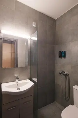 a bathroom with a sink and a shower at Tyto Alba Habitat in Athens