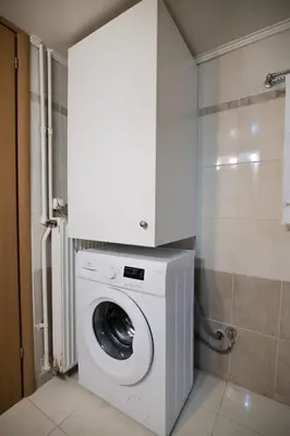 a washing machine in a bathroom with a shower at Maria Cozy Getaway in Glyfada in Athens