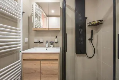 a bathroom with a sink and a shower at Affordable Luxury with parking 300Mbps wifi in Athens