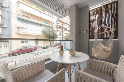 a room with a table and chairs and a window at Affordable Luxury with parking 300Mbps wifi in Athens