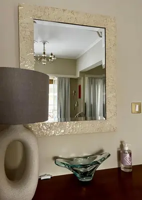 a bathroom with a mirror and a bowl on a table at Carones apartment in Athens