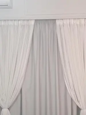 a window with white curtains in a room at Artemis ktparadise in Athens