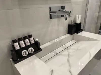 a bathroom with a white marble floor and a sink at Romantic Jacuzzi&Spa Residence Near Acropolis- Fix Metro 180m in Athens