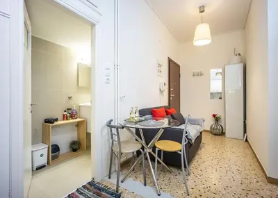 a small room with a table and a small apartment at Acropolis 5 Hills 1st FLR Aprt by Lodgespot in Athens