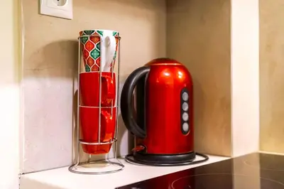 two vases sitting next to each other on a counter at Acropolis 5 Hills 1st FLR Aprt by Lodgespot in Athens