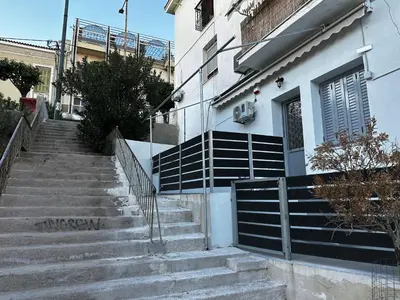 a set of stairs in front of a building at MMs house at Mikrolimano in Piraeus