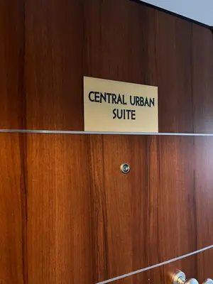 a sign on a wooden door that reads central imperial suite at Family Suite by Zeussuites in Athens